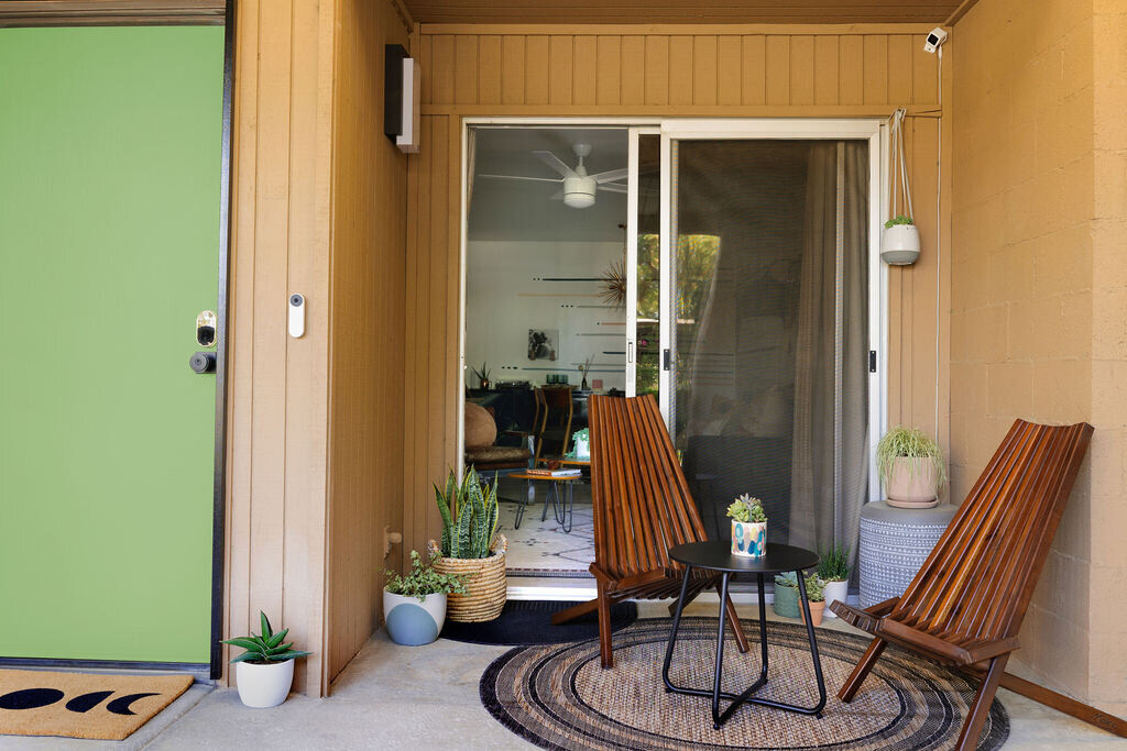 Sage green living space with calming wellness-focused decor